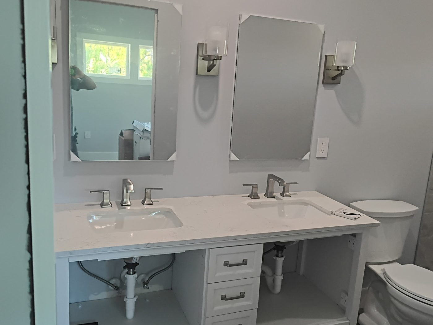Finished double vanity with quartz countertop and brushed nickel faucets